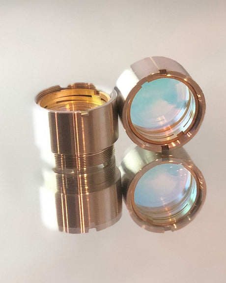 Fiber laser collimating and focusing lenses